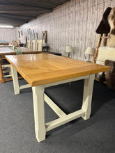 Load image into Gallery viewer, Featuring a charming two-tone rustic finish, this extendable dining table accommodates 6–10 guests with ease. Built to last, it showcases the character of pre-loved furniture with subtle patina marks that enhance its authentic appeal. The smooth extension mechanism allows you to adapt the table for intimate dinners or larger gatherings. An ideal centrepiece for country-style homes and period properties seeking genuine character and practicality.
Delivery Available
Overall Dimensions
160cm long x 90cm wid