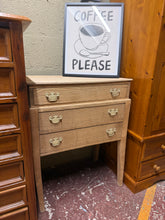 Load image into Gallery viewer, A beautiful stripped oak chest of drawers, restored to its natural finish. Features three spacious long drawers ideal for bedroom or living room storage. The piece splits in two for convenient transportation and repositioning. The natural wood may benefit from a protective wax coat to enhance durability and appearance.
Delivery Available
Overall Dimensions
70cm wide x 38cm deep x 89cm high
