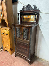 Load image into Gallery viewer, This beautiful mahogany music cabinet is sturdy and well-maintained. It shows some minor surface scratches, but nothing significant. Featuring a double cupboard with a lockable key and a single cupboard with three shelves, it’s ideal for organizing your music sheets and accessories.
Overall Dimensions
60cm wide x 39cm deep x 154cm high
DELIVERY AVAILABLE
For our other items see our website https://fossewayfurniture.co.uk
collection from our shop at cv36, our collection zone at bs36 or otherwise d