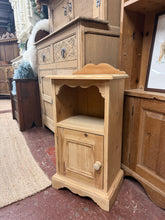 Load image into Gallery viewer, This cute solid pine bedside is structrually sound and in overall good condition. It is used and does have some marks. It has a cubby hole and small cupboard for storage. Sweet little statement piece.
Delivery Available
Overall Dimensions
38cm wide x 26.5cm deep x 75cm high