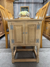Load image into Gallery viewer, This beautifully stripped oak cupboard showcases natural wood grain and character. Returned to its raw state, it's ready for your finishing touches—a protective wax coat will enhance both appearance and durability. Single cupboard storage offers practical organisation in a compact footprint. Structurally sound with great condition throughout, it's an ideal piece for those seeking authentic, natural furniture with timeless appeal.
Delivery Available
Overall Dimensions
50cm wide x 35.5cm deep x 71cm high