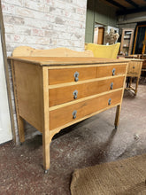 Load image into Gallery viewer, Stripped mahogany chest of drawers with solid structural integrity. This characterful piece features a classic 2-over-2 drawer configuration, offering practical storage with genuine period appeal. The natural wood finish showcases the mahogany grain beautifully, while minor surface marks are present it doesn't affect its use. Ideal for those seeking a quality furniture project or as a statement piece for eclectic interiors.
Delivery Available
Overall Dimensions
107cm wide x 48.5cm deep x 80/90cm hi