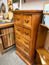 Load image into Gallery viewer, Characterful mango wood tallboy combining rustic charm with practical storage. This pre-loved piece features authentic patina and minor wear that adds to its vintage appeal. Seven drawers in total—four compact upper drawers and three generous lower drawers—provide flexible organisation for bedrooms, living spaces, or hallways. Solid construction ensures lasting durability.
Delivery Available
Overall Dimensions
55cm wide x 30cm deep x 111cm high
