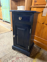 Load image into Gallery viewer, Built from solid pine with genuine dovetail joinery, this cupboard arrives in navy paint applied by previous owners. The design combines a shallow drawer with a lower storage cupboard, offering flexible placement in a bedroom, kitchen, or hallway.
Delivery Available
Overall Dimensions
35.5cm wide x 30cm deep x 69cm high