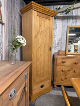 Load image into Gallery viewer, A charming vintage pine wardrobe in structurally sound condition with characterful patina. Features a hanging rail, dovetail-jointed drawer, and original key. Ideal for country-style interiors and period homes seeking authentic period furniture with genuine heritage appeal.
Delivery Available
Overall Dimensions
69cm wide x 48cm deep x 186cm high