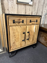 Load image into Gallery viewer, This charming industrial cupboard, crafted from wood and metal, is solidly built and in good overall condition. While it shows some minor signs of use, there are no significant blemishes. It features two small drawers above a double-door cupboard with a spacious long shelf inside.
Delivery Available
Overall Dimensions
64.5cm wide x 31cm deep x 71cm high 