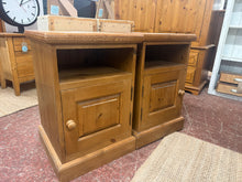 Load image into Gallery viewer, These 2 x Pine Bedsides are durable and in good condition. While there may be some minor blemishes, overall they are in great shape. Each bedside has a storage cubby and cupboard.
Overall Dimensions
43.5cm wide x 42.5cm deep x 64cm high
DELIVERY AVAILABLE    
HAVE THIS PAINTED A COLOUR OF YOUR CHOICE FOR AN EXTRA £80 OR COMPLETELY STRIPPED BACK FOR £100 
For our other items see our website https://fossewayfurniture.co.uk
collection from cv36 or delivery available