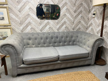 Load image into Gallery viewer, This fabulous light grey 3 seater Chesterfield sofa is in great condition, with just a few small marks and pulls that can easily be taken care of. A quick clean and it will be good as new!
Overall Dimensions
approx : 117cm long x 90cm deep x 75cm high
DELIVERY AVAILABLE    
For our other items see our website https://fossewayfurniture.co.uk
collection from cv36 or bs36