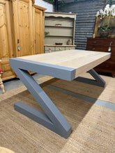 Load image into Gallery viewer, This stunning dining table is structurally sound and in great condition. The top has been sanded and lime washed while the base has been painted in 'Greyhound' by Frenchic. The legs can come off for easier moving
Overall Dimensions
180cm long x 90cm wide x 77cm high 
DELIVERY AVAILABLE    
For our other items see our website https://fossewayfurniture.co.uk
collection from cv36 or bs36