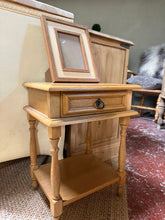 Load image into Gallery viewer, Practical oak style side table with plenty of storage options. Features a single drawer and lower shelf, perfect for keeping essentials within reach. Shows minor use-related marks consistent with pre-loved furniture, but remains structurally sound and fully functional.
Delivery Available
Overall Dimensions
38cm wide x 32cm deep x 51.5cm high