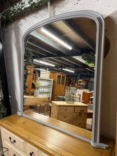 Load image into Gallery viewer, This large over mantle mirror is structurally sound and in overall good condition. It has been painted in a grey by its previous owners so may need a touch top in areas. The glass is all intact.
Overall Dimensions
126cm wide x 121.5cm high
DELIVERY AVAILABLE    
For our other items see our website https://fossewayfurniture.co.uk
collection from cv36 or bs36