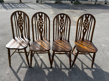 Load image into Gallery viewer, Set of four Windsor-style wheelback chairs with authentic period charm. Each chair is structurally sound and in good overall condition, showing gentle signs of age and use consistent with vintage furniture. Perfect for adding character to country homes or traditional settings.
Delivery Available
Overall Dimensions
approx : 38cm wide x 45cm deep x 98cm high 