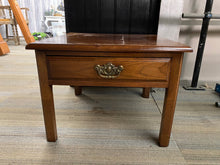 Load image into Gallery viewer, This captivating solid wooden side table is built with sturdy structure and stands in remarkable condition. It has 1 compact dovetailed drawer for keeping essentials, and while it has been used, any marks are very minor. Overall Dimensions 58cm wide x 57cm deep x 44cm high DELIVERY AVAILABLE For our other items see our website https://fossewayfurniture.co.uk