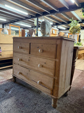 Load image into Gallery viewer, This charming vintage pine chest features authentic dovetail joinery with two short drawers positioned above two generous long drawers, offering practical storage with character. Stripped back to reveal natural wood grain, the piece is structurally sound and ready for use. The patina includes minor marks and surface wear that add to its vintage appeal without affecting functionality. A protective coat of wax will enhance the finish and preserve the wood for years to come.
Delivery Available
Overall Dimens
