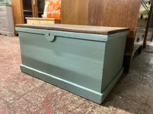 Load image into Gallery viewer, This cute solid pine blanket box is structurally sound and in overall good condition. It has been painted in a sage green with the top given an oak wax. The lid lifts up to reveal ample storage.
Overall Dimensions
84cm wide x 57cm deep x 44.5cm high
DELIVERY AVAILABLE    
For our other items see our website https://fossewayfurniture.co.uk
collection from cv36 or bs36