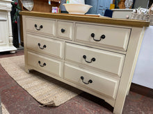 Load image into Gallery viewer, This stunning country style two tone chest of drawers is structurally sound and in overall good condition. It does have a few marks but nothing too major. It offers ample storage with 4 long dovetail jointed drawers, 2 medium and 1 small. Originally from oak furniture land or a similar shop.
Overall Dimensions
135cm wide x 43cm deep x 79cm high
DELIVERY AVAILABLE
For our other items see our website https://fossewayfurniture.co.uk
collection from cv36 or bs36