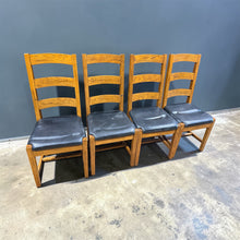 Load image into Gallery viewer, A charming set of four oak chairs, each structurally sound and ready for use. The natural patina reflects their age and character. Seat pads show minor denting that may diminish with use. One chair features a small loss to the backrest that does not compromise functionality.
Delivery Available
Overall Dimensions
approx : 43cm wide x 42.5cm deep x 105.5cm high 