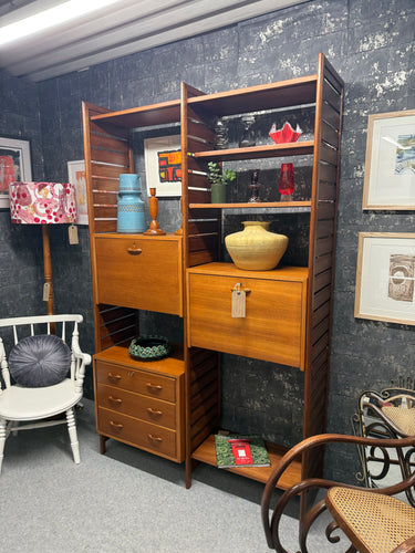 This charming Ladderax unit by Robert Heal from Staples dates back to the 1960s and has been carefully refurbished to excellent condition. It offers plenty of storage with three dovetailed drawers, two shelves, and two cupboards. Plus, it can be taken apart for easy moving.

Delivery Available

Overall Dimensions

124cm wide x 39cm deep x 201cm high     
