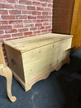 Load image into Gallery viewer, Crafted from solid pine in its raw, natural finish, this blanket box arrives ready for your personal touch—a light wax coating will enhance both protection and appearance. Dual side handles make repositioning effortless, whilst the generous interior provides ample space for storing blankets, linens, or seasonal items. A versatile piece that combines practical storage with rustic charm.

Delivery Available

Overall Dimensions

90cm wide x 49cm deep x 49.5cm high

