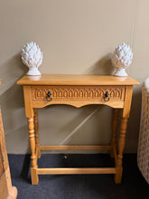 Load image into Gallery viewer, A sturdy wooden console table with timeless appeal. This narrow design fits perfectly in entryways, hallways, or living spaces. Features a single drawer for convenient storage. Solid construction with minor wear marks consistent with its pre-loved character. Ready to add warmth and function to your home.

Delivery Available

Overall Dimensions

82cm wide x 38.5cm deep x 77cm high


