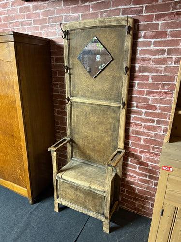 This beautiful wooden hall stand is sturdy and well-maintained. While it shows some light signs of use, they are minor and barely noticeable. It features six hooks for hanging, a seat that lifts to reveal generous storage space, and includes a handy mirror. This is the perfect piece for your hallway.

Delivery Available

Overall Dimensions

64cm wide x 31cm deep x 176cm high   

