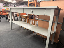 Load image into Gallery viewer, A versatile light grey console table with practical storage solutions. Features two spacious drawers and a lower shelf, ideal for organising entryway essentials or displaying décor. Shows honest signs of use with minor marks. Structurally sound and ready to enhance any hallway or living space.

Delivery Available

Overall Dimensions

160cm wide x 50cm deep x 86cm high&nbsp;&nbsp;

