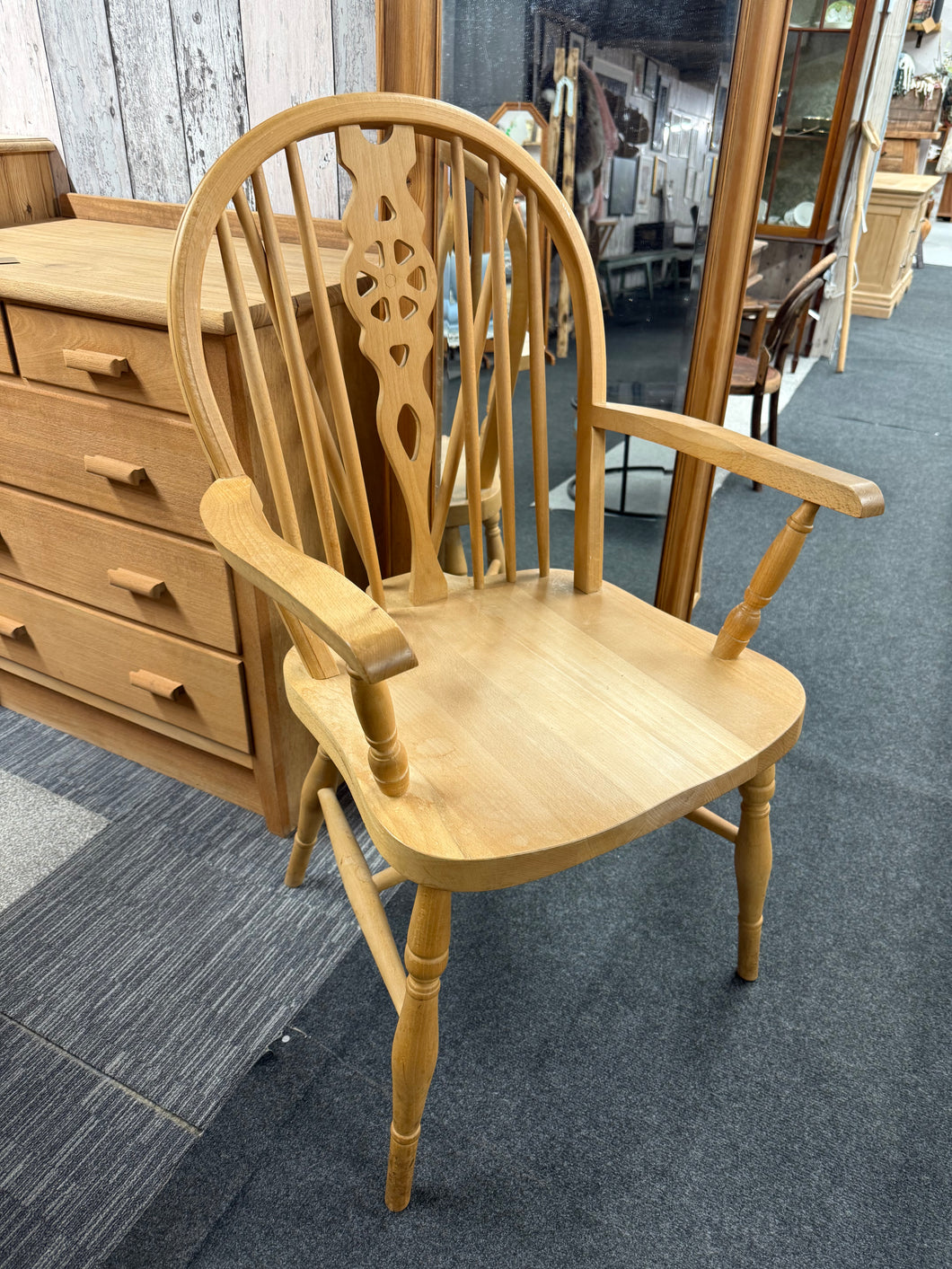 This beautiful solid pine wheel-back carver is sturdy and well-maintained. It shows some signs of use, but only minor marks that don’t detract from its charm. Ideal for a cozy bedroom chair or to complete your dining table setup.

Delivery Available

Overall Dimensions

approx : 55cm wide x 49cm deep x 92cm high      

