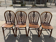 Load image into Gallery viewer, This charming set of oak wheelback chairs are sturdy and well-maintained. While they show some signs of use, the marks are minor and do not detract from their overall good condition.

Overall Dimensions

approx : 37cm wide x 39cm deep x 90cm high

DELIVERY AVAILABLE      

HAVE THIS PAINTED A COLOUR OF YOUR CHOICE FOR AN EXTRA £120 OR HAVE IT COMPLETELY STRIPPED BACK FOR JUST £130    

For our other items see our website https://fossewayfurniture.co.uk

collection from our shop at cv36, our collection zone 
