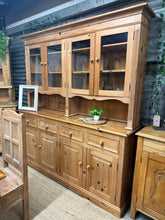 Load image into Gallery viewer, A characterful vintage pine dresser with solid construction and authentic patina. Features two upper cupboards, four dovetail-jointed drawers, and two double cupboards in the base—offering generous storage throughout. Separates into two sections for convenient transport and placement. Used condition with minor marks consistent with age; structurally sound and ready for a new home.

Delivery Available

Overall Dimensions

180cm wide x 45cm deep x 198.5cm high&nbsp;

