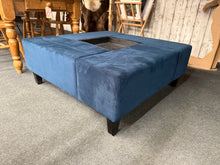 Load image into Gallery viewer, A versatile navy blue piece that serves double duty as both coffee table and pouffe. Solidly constructed and well-maintained, it features a removable centre tray for added flexibility. Ideal for anchoring your living room with practical style and functionality.

Delivery Available

Overall Dimensions

102cm wide x 102cm deep x 40cm high&nbsp;

