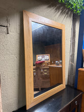 Load image into Gallery viewer, Oak-framed mirror with character. Structurally sound and fully functional, featuring the natural patina of a well-loved piece. Minor surface marks reflect its history—perfect for adding warmth and vintage charm to any room. A timeless accent that brings depth and light to your space.

Delivery Available

Overall Dimensions

78cm wide x 109cm high

