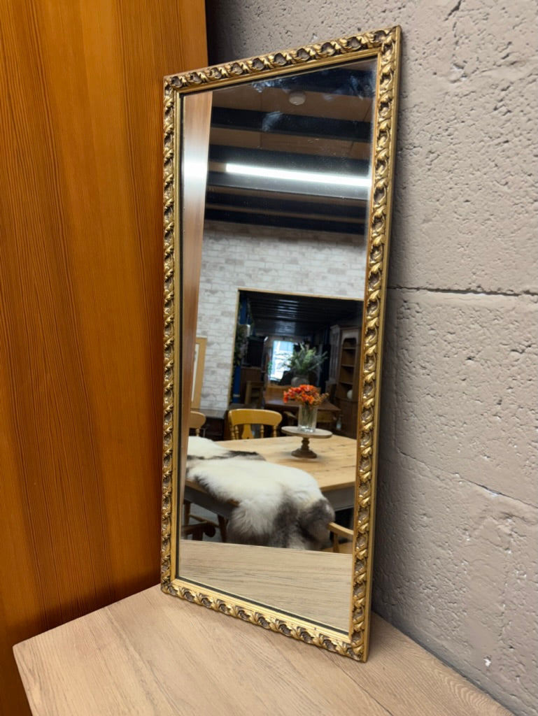 This beautiful gold-framed mirror is sturdy and in great overall condition. It shows some minor signs of use but nothing significant. A hanging chain is attached to the back for easy display.

Delivery Available

Overall Dimensions

35cm wide x 80.5cm high
