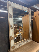 Load image into Gallery viewer, This striking large hardwood mirror features a bevelled edge and soft whitewash finish that complements both contemporary and classic interiors. The robust hardwood construction ensures lasting durability, while the elegant bevelled detailing adds depth and sophistication to any room. A versatile statement piece that brings light and dimension to hallways, living spaces, or bedrooms.

Delivery Available

Overall Dimensions

84cm x 116cm


