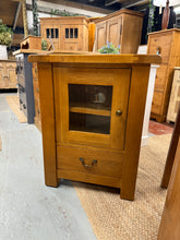 Load image into Gallery viewer, Built to last, this solid oak cupboard delivers both strength and style. Featuring a spacious compartment with one shelf and a dovetail drawer, it offers versatile storage solutions for any space. Lovingly used yet impeccably preserved, this quality piece showcases the enduring appeal of genuine oak whilst providing the reliable performance you&#39;d expect from fine furniture.

Delivery Available

Overall Dimensions

64cm wide x 45cm deep x 80cm high&nbsp; &nbsp; &nbsp; 

