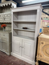 Load image into Gallery viewer, A charming wooden bookcase with authentic character. Built to last, this piece features solid construction and displays a soft grey finish with natural patina. Three spacious shelves offer flexible storage for books, décor, and everyday essentials. Some minor touch-ups to the paintwork may be desired, and shelf pins are required for bottom shelf. Perfect for adding warmth and functionality to any room.

Delivery Available

Overall Dimensions

96cm wide x 35cm deep x 167cm high

