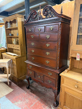 Load image into Gallery viewer, This Chippendale-style chest on chest combines practical storage with stunning design. Twelve drawers in graduated sizes—four long with dovetail joinery, two medium, and six compact—accommodate varied storage needs. The piece remains in sound condition with only minor wear marks. Designed to separate into two sections for straightforward transport and room placement, it serves as a functional bedroom statement piece.&nbsp;

Delivery Available

Overall Dimensions

100cm wide x 41cm deep x 199cm high
