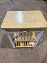 Load image into Gallery viewer, A compact pine kitchen island offering practical storage solutions with one drawer and two shelves. This pre-loved piece shows honest signs of use with minor surface marks, but remains structurally solid and fully functional. Ideal for adding workspace and storage to smaller kitchens without compromising on durability.

Delivery Available

Overall Dimensions

60cm wide x 43cm deep x 85cm high&nbsp;

