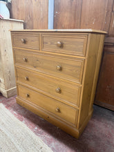 Load image into Gallery viewer, A charming solid pine chest of drawers built to last. Featuring two short dovetail-jointed drawers above three spacious long drawers, this piece offers generous storage for any room. The removable glass top adds versatility and protects the surface. Structurally sound and in excellent condition, it's an ideal addition to country-style interiors and traditional homes.

Delivery Available

Overall Dimensions

101cm wide x 46cm deep x 102cm high

