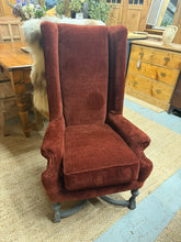 Load image into Gallery viewer, A charming rust-toned armchair with solid construction and excellent overall condition. Features distinctive black cross-banded legs that add visual interest to any room. There's a minor tear that's easily repairable. Ideal for creating a cosy reading nook or positioning by the fireplace for a welcoming focal point.

Delivery Available

Overall Dimensions

approx : 68cm wide x 64cm deep x 112cm high

