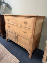 Load image into Gallery viewer, A beautiful stripped mahogany cupboard, restored to reveal its natural grain and warm tones. Features two spacious dovetail-jointed drawers above a generous double cupboard, offering excellent storage capacity. Structurally sound and in good overall condition. The stripped finish showcases the wood's character—a light coat of wax will enhance protection and bring out the rich patina. Ideal for those who appreciate authentic period furniture with practical functionality.

Delivery Available

Overall Dimensio
