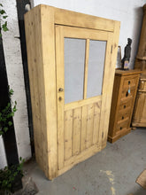 Load image into Gallery viewer, This charming antique pine larder showcases authentic character with its stripped finish and gentle patina from years of use. The three internal shelves provide practical storage, while the included key adds to its vintage appeal. A protective coat of wax will enhance the wood and safeguard against wear. Perfect for those seeking genuine period furniture with rustic charm and functional design.

Delivery Available

Overall Dimensions

90cm wide x 35cm deep x 160cm high
