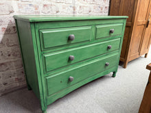 Load image into Gallery viewer, This sturdy wooden chest of drawers is painted a cheerful mid-green shade by its previous owners, with a few spots that might need a little refreshing. It features two small dovetail-jointed drawers above two larger ones, offering plenty of storage space.

Overall Dimensions

104cm wide x 47cm deep x 77cm high

DELIVERY AVAILABLE      

For our other items see our website https://fossewayfurniture.co.uk

collection from our shop at cv36, our collection zone at bs36 or otherwise delivery is available

