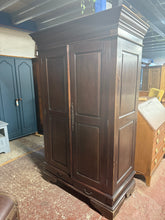 Load image into Gallery viewer, This beautiful mahogany wardrobe is sturdy and well-maintained. While it shows some minor scratches and marks, these can easily be refreshed with wax or a fresh coat of paint. It offers generous storage space, featuring one cupboard with a hanging rail, another with two shelves, plus two drawers at the bottom for additional storage.

Overall Dimensions

114cm wide x 61cm deep x 184cm high

DELIVERY AVAILABLE      

HAVE THIS PAINTED A COLOUR OF YOUR CHOICE FOR AN EXTRA £100 OR HAVE IT COMPLETELY STRIPPED BA
