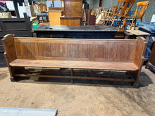 Load image into Gallery viewer, This substantial Pitch Pine Pew showcases the natural beauty of age-worn timber, complete with the marks and patina that tell its story. Built to last, the piece maintains excellent structural integrity. With seating for six, it's a practical yet atmospheric addition to dining spaces, kitchens, or hallways—perfect for anyone drawn to authentic vintage appeal and the warmth of reclaimed furniture.

Delivery Available

Overall Dimensions

258cm long x 52cm deep x 96cm high&nbsp;


