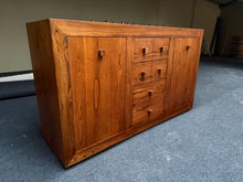 Load image into Gallery viewer, This zebrawood sideboard delivers dependable storage without pretence. Featuring four short dovetail-jointed drawers, two long drawers, and dual cupboards, it provides ample space for tableware, linens, and household items. The piece maintains structural integrity and remains fully operational despite its pre-owned status—light surface marks are simply evidence of honest use rather than any cause for concern. A practical, hardwearing addition to any dining or living area.

Delivery Available

Overall Dimens
