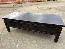 Load image into Gallery viewer, A distinctive mid-century Chinoiserie coffee table with timeless appeal. Structurally sound and in good overall condition, this piece features three practical short drawers ideal for storing remotes, magazines, and small items. As a pre-loved item, it carries subtle patina marks that add character without compromising function. Perfect for adding an elegant, curated accent to living rooms and period interiors.

Delivery Available

Overall Dimensions

122cm wide x 51cm deep x 40cm high

