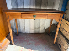Load image into Gallery viewer, This charming oak hall table is sturdy and well-maintained. While it shows some signs of use, the marks are minor and do not detract from its appeal. It features a convenient front drawer for extra storage.

Overall Dimensions

91cm wide x 42cm deep x 69cm high

DELIVERY AVAILABLE      

HAVE THIS PAINTED A COLOUR OF YOUR CHOICE FOR AN EXTRA £60 OR HAVE IT COMPLETELY STRIPPED BACK FOR JUST £65    

For our other items see our website https://fossewayfurniture.co.uk

collection from our shop at cv36, our col
