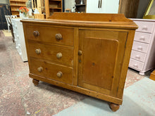 Load image into Gallery viewer, A charming vintage pine sideboard brimming with character and practical storage. Featuring three dovetail-jointed drawers and an internal shelved cupboard, this piece offers generous space for your belongings. Built to last with solid construction, it's in great condition and ready to become a treasured addition to your home. The missing back panel can easily be replaced.

Overall Dimensions

121cm wide x 47cm deep x 90cm high / 99cm high to back panel

DELIVERY AVAILABLE      

For our other items see our 
