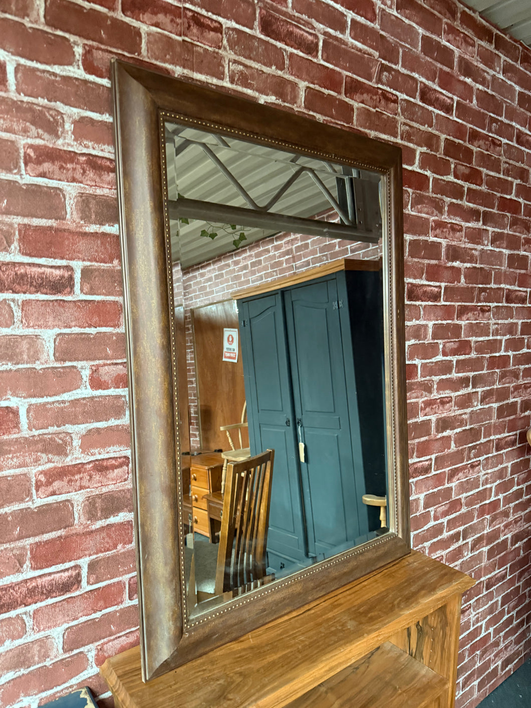 This charming industrial-style mirror with a bevelled edge is solidly built and in good overall shape. As a pre-loved piece, it shows some minor signs of use, but nothing significant.

Delivery Available

Overall Dimensions

77cm wide x 108cm high
