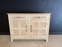 Load image into Gallery viewer, A beautiful Ercol sideboard, stripped back to reveal its natural wood grain. Features two short drawers above a spacious double cupboard, offering practical storage with classic mid-century appeal. Structurally sound and in excellent condition. The natural finish may benefit from a protective coat of wax to enhance durability and appearance.

Delivery Available

Overall Dimensions

123cm wide x 45.5cm deep x 86.5cm high

